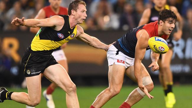 Dylan Grimes chases down Christian Petracca. Picture: Getty Images