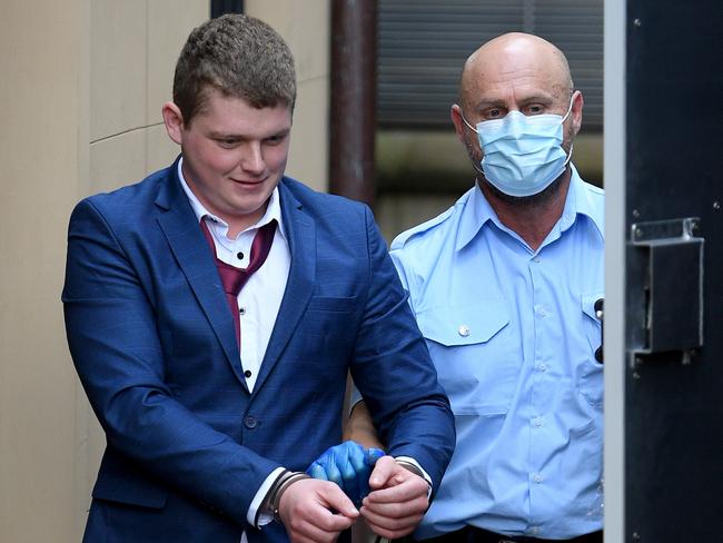 Nathan Kelly being led to a Corrective Services transport van at the NSW Supreme Court in Sydney. Picture: AAP Image/Dan Himbrechts