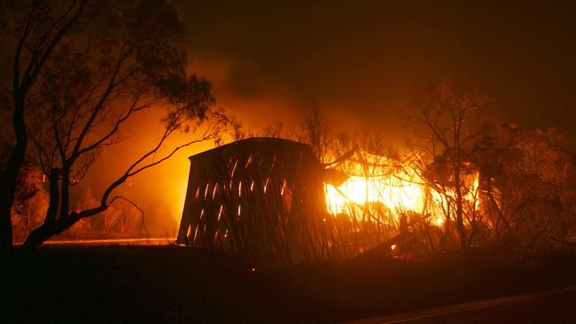 Shed and haystacks burning in the Bunyip State Park bushfire in 2009. Picture: CFA