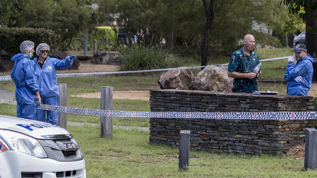 Police and Forensic Services officers attend the scene of a shooting in the suburb of Wakerley where a Gold Coast man was shot and killed by police in Brisbane, Sunday, February 25, 2018. Police were called by residents who were in fear of a man reportedly armed with a knife and trying to break in. (AAP Image/Glenn Hunt