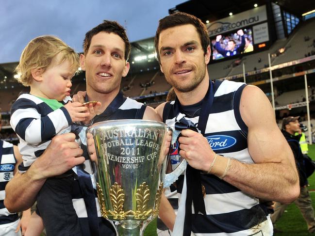 Harry Taylor with son James and Matthew Scarlett after the 2011 grand final.