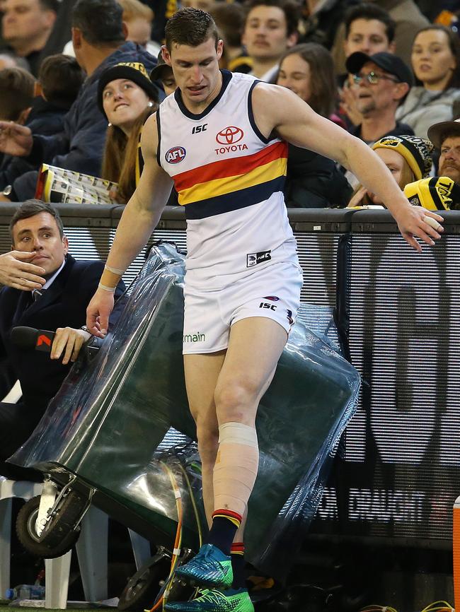 Adelaide's Josh Jenkins collides with the Channel 7 crew on the boundary on Friday night. Picture: Michael Klein