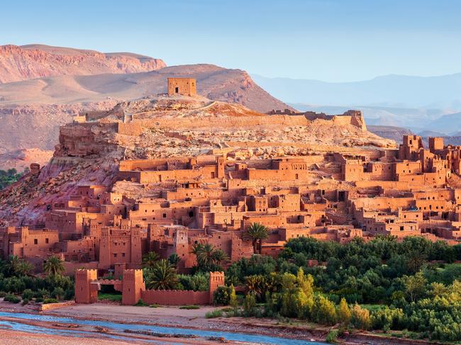 Ouarzazate on the edge of the Sahara desert in Morocco. Taken as dawn broke. Famous for it use as a set in many films such as Lawrence of Arabia, Gladiator, Jewel of the Nile, Kingdom of Heaven, Kundun and Alexander North Africa. Nikon D3x.