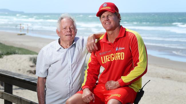 Colin Blumson, 78, is reunited with his rescuer, senior lifeguard Michael Daly at Coolum Beach. Picture: Liam Kidston