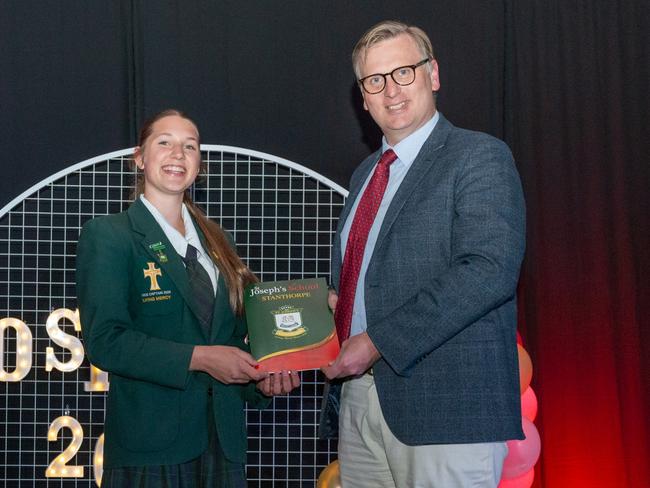 St Joseph's College Stanthorpe vice captain Eliza Telfer (L) with Member for Southern Downs James Lister MP (R) at the 2023 awards night. Photo: Contributed