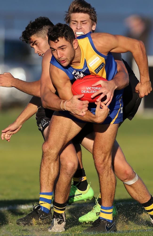 Towner Ben Cavarra fights for possession against Richmond.