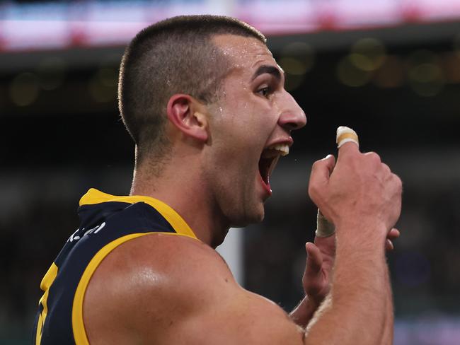 ADELAIDE, AUSTRALIA - AUG 17: Josh Rachele of the Crows gestures to the crowd after scoring a goal during the 2024 AFL Round 23 match between the port Adelaide Power and the Adelaide Crows at Adelaide Oval on August 17, 2024 in Adelaide, Australia. (Photo by James Elsby/AFL Photos via Getty Images)