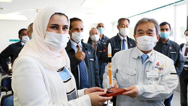 Sarah al-Amiri, left, the UAE’s minister of state for advanced sciences, and Naohiko Abe, head of integrated defence and space systems of MHI, celebrate the success of the H-2A rocket launch at the Tanegashima Space Centre in Japan. Picture: Mitsubishi Heavy Industries via AFP