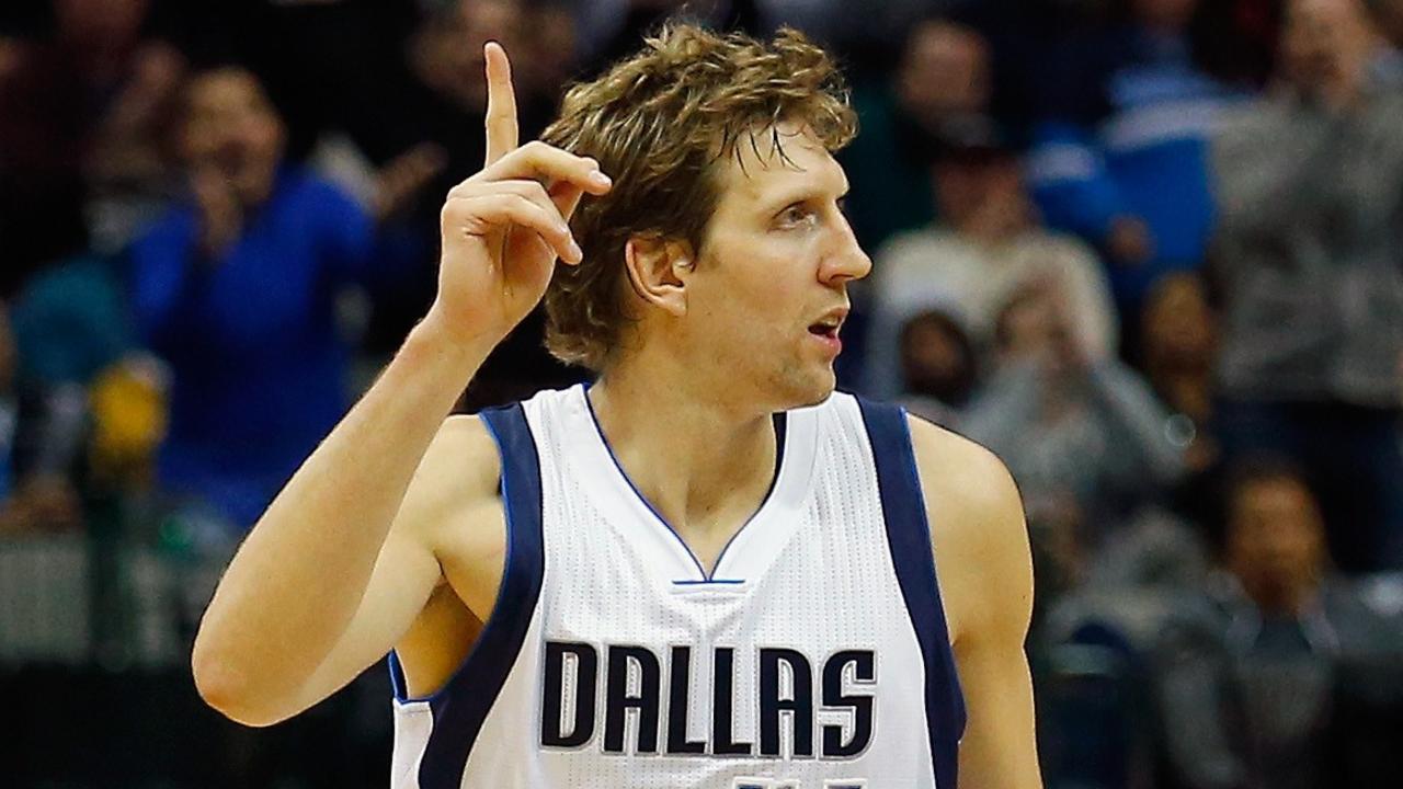 DALLAS, TX - NOVEMBER 11: Dirk Nowitzki #41 of the Dallas Mavericks celebrates after scoring against Carl Landry #24 of the Sacramento Kings to take 9th place on the NBA's All-Time Scoring list in front of Hakeem Olajuwon against the Sacramento Kings on November 11, 2014 at the American Airlines Center in Dallas, Texas. Tom Pennington/Getty Images/AFP == FOR NEWSPAPERS, INTERNET, TELCOS & TELEVISION USE ONLY ==