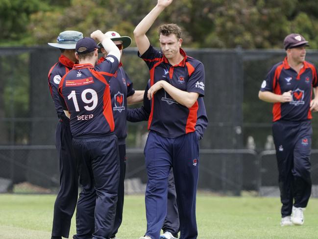 The Oakleigh players celebrate a wicket. Picture: Valeriu Campan