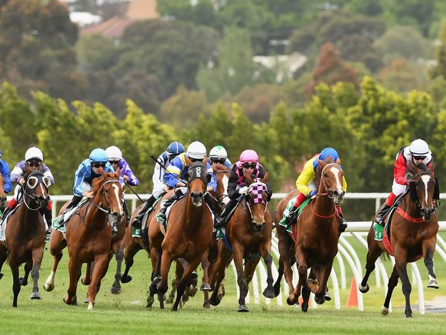 Playing poker machines these days is nothing like having a bet on the Melbourne Cup or the Grand Final. Picture: Getty Images