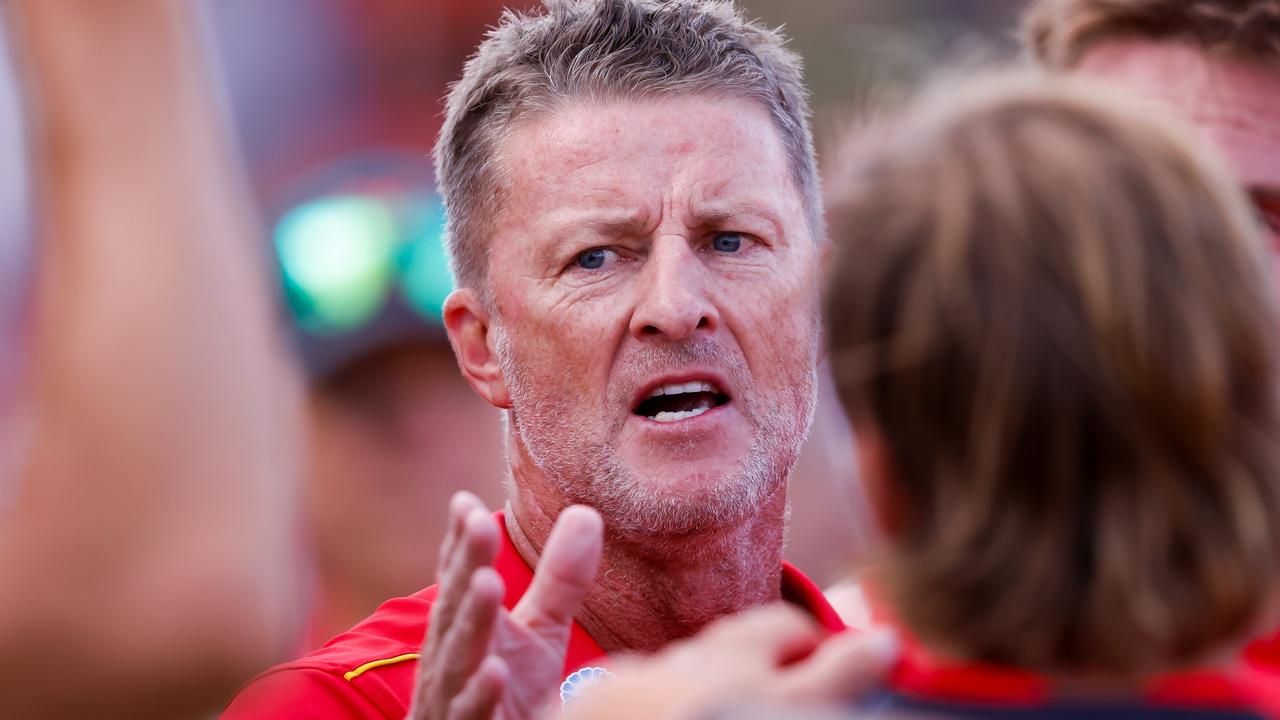 GOLD COAST, AUSTRALIA - MARCH 09: Damien Hardwick, Senior Coach of the Suns addresses his players at quarter time during the 2024 AFL Opening Round match between the Gold Coast SUNS and the Richmond Tigers at People First Stadium on March 09, 2024 in Gold Coast, Australia. (Photo by Dylan Burns/AFL Photos via Getty Images)