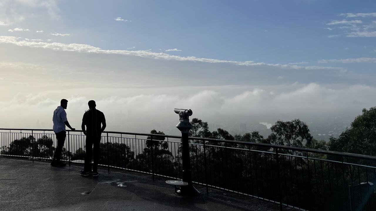 Fog blocks the view of the Brisbane CBD from Mt Coot-tha. Picture: Steve Pohlner