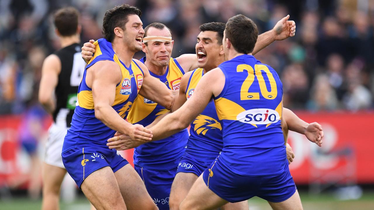 Eagles players react after winning the 2018 AFL Grand Final.