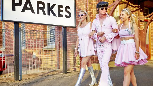 An Elvis look-a-like and friends enjoy the Parkes Elvis Festival in 2014.