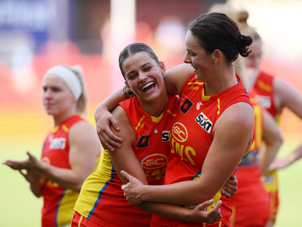 Annabel Kievit of the Suns shares a laugh with Katie Lynch of the Suns after the loss against Geelong. Picture: Matt Roberts/Getty Images.