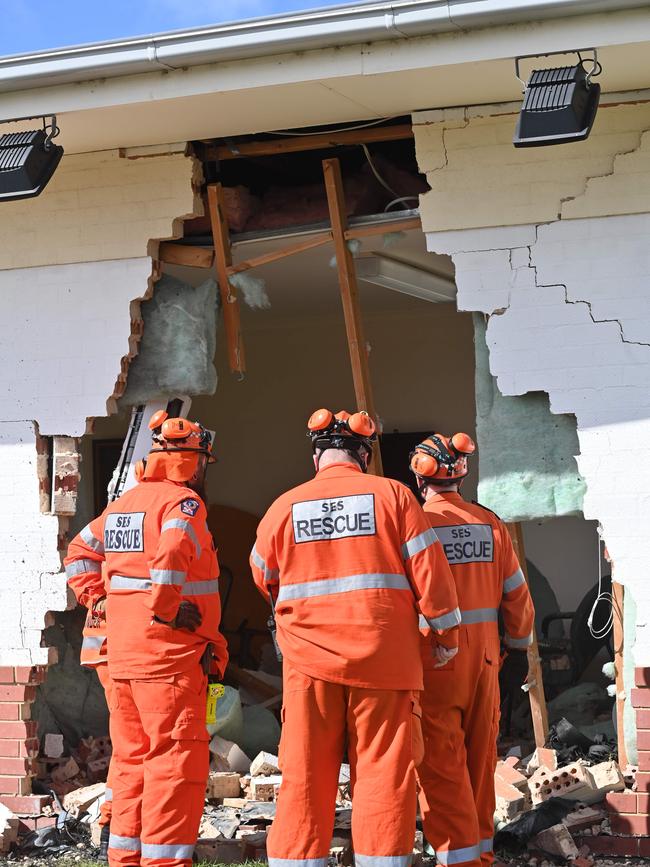 Emergency services personnel survey the damage. Picture: Keryn Stevens