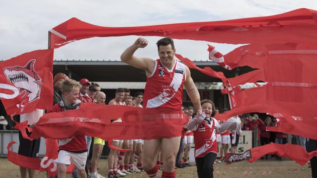 Guy Stringer breaks through his 400-game banner. Picture: Christopher Chan.