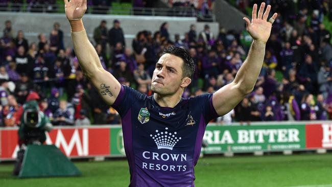 **FILE** A Saturday, Sept. 24, 2016 image reissued Tuesday, April 4, 2017 of Melbourne Storm halfback Cooper Cronk after playing his 300th game in the NRL preliminary final between the Melbourne Storm and the Canberra Raiders at AAMI Park in Melbourne. Cooper Cronk will seek to join a Sydney club after reportedly deciding to leave Melbourne at the end of the NRL season. (AAP Image/Julian Smith) NO ARCHIVING, EDITORIAL USE ONLY