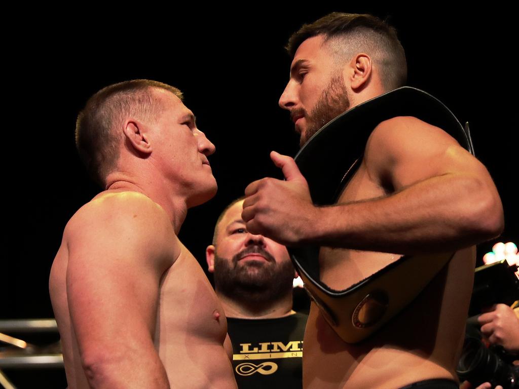 Paul Gallen faces off with opponent Kris Terzievski during the King of the Castle official weigh-in in Newcastle on Tuesday. Picture: Peter Lorimer/Getty Images