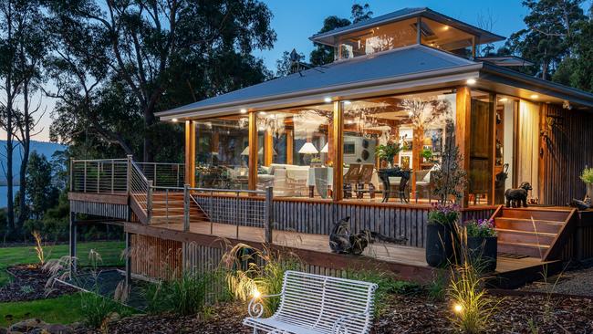 Huon River Hideaway file 4 exterior of Huon River Hideaway showing side wall of full length windows. MUST CREDIT Jon Jarvela photographs For a TasWeekend travel story.