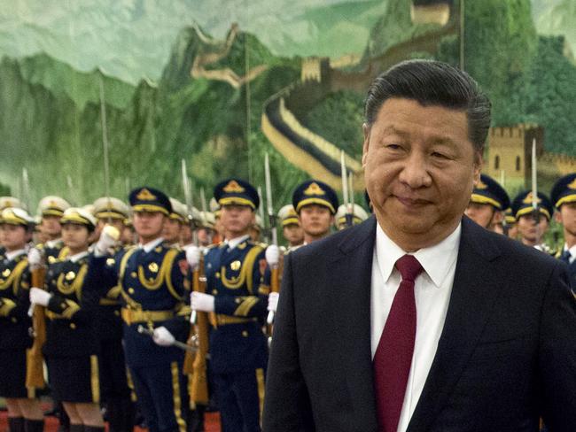 Chinese President Xi Jinping reviews an honour guard. Picture: AP