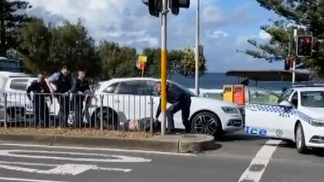 The dramatic footage of Mr Ramsay’s arrest shows him being handcuffed while on the ground at a traffic stop on Bondi’s busiest road. Picture: 7 News