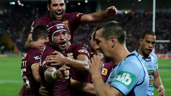 QLD's Will Chambers celebrates a try as Johnathan Thurston mouths off at Mitchell Pearce during Origin Game 3 between New South Wales and Queensland at Suncorp Stadium .Picture Gregg Porteous