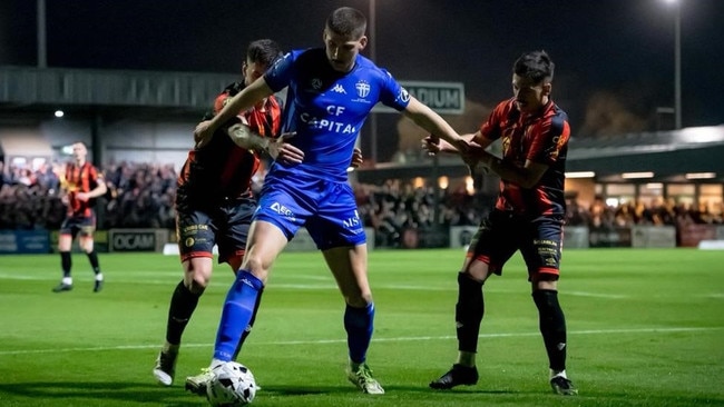 Harrison Sawyer tries to hold off two Preston defenders. Picture: Luke Radzminiski