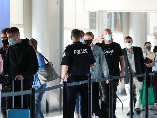 Travellers from Sydney arriving at Brisbane Domestic Airport. Pics Tara Croser.