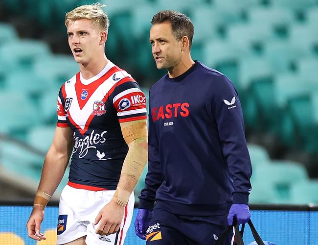 Freddy Lussick of the Roosters leaves the field with an arm injury (Photo by Mark Kolbe/Getty Images)