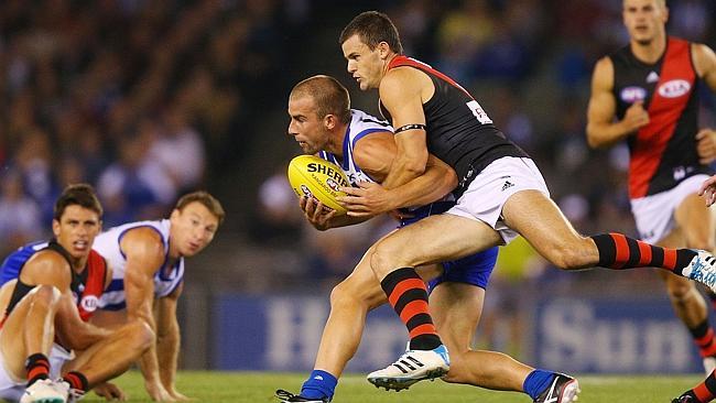 Brent Stanton puts the clamps on Ben Cunnington. Photo by Michael Dodge