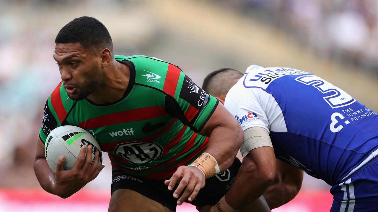 SYDNEY, AUSTRALIA - APRIL 15: Taane Milne of the Rabbitohs is tackled during the round six NRL match between the South Sydney Rabbitohs and the Canterbury Bulldogs at Stadium Australia, on April 15, 2022, in Sydney, Australia. (Photo by Cameron Spencer/Getty Images)