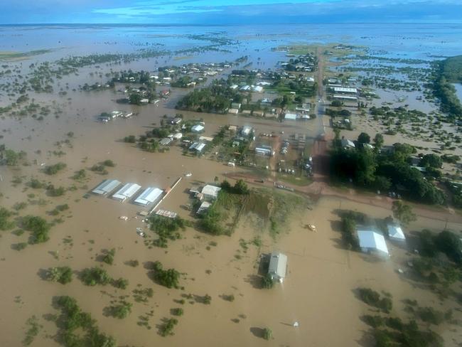 This handout photo taken on March 10, 2023 and received on March 11, 2023 from the Queensland Police Service shows an aerial view of the flooded northern Queensland town of Burketown. - Police urged all residents of the remote Australian town to evacuate on March 11, 2023, warning that record-high floodwaters were expected to rise further over the weekend. (Photo by Handout / QUEENSLAND POLICE SERVICE / AFP) / ----EDITORS NOTE ----RESTRICTED TO EDITORIAL USE MANDATORY CREDIT " AFP PHOTO / QUEENSLAND POLICE SERVICE" NO MARKETING NO ADVERTISING CAMPAIGNS - DISTRIBUTED AS A SERVICE TO CLIENTS