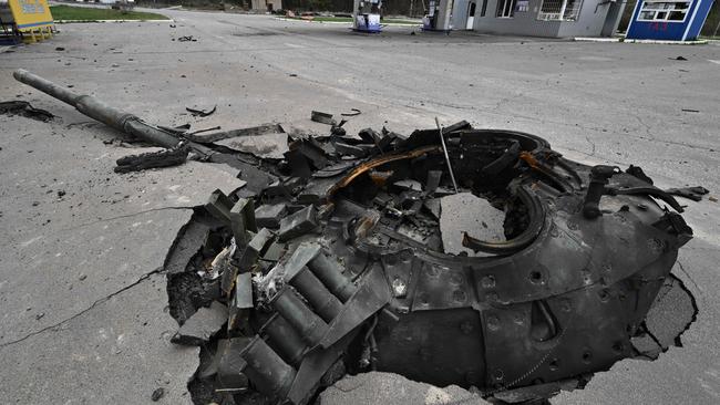 Debris of a destroyed Russian tank at a damaged petrol station near the village of Zalissya, northeast of Kyiv, on April 12, 2022. Picture: Genya Savilov/AFP