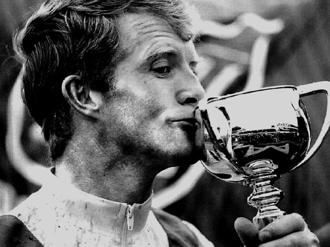 Jockey Michael Kinane kisses the Melbourne Cup trophy after Vintage Crop’s win in 1993.