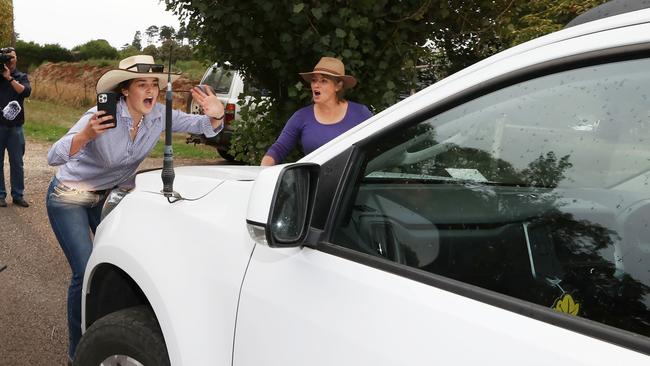 Young farmer Joee Aganetti Fraser blocks an SUV carrying AusNet representatives leaving a meeting in Dean. Picture: David Caird