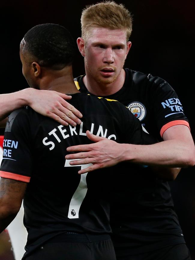 Manchester City's Kevin De Bruyne hugs Raheem Sterling. Picture: AFP