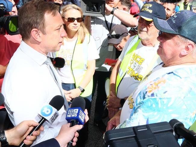 BRISBANE, AUSTRALIA - NewsWire Photos APRIL 30, 2024: Queensland Premier Steven Miles speaks to crime victim Russel Field outside the Parliament during a Voice for Victims rally in Brisbane. Picture: NCA NewsWire/Tertius Pickard