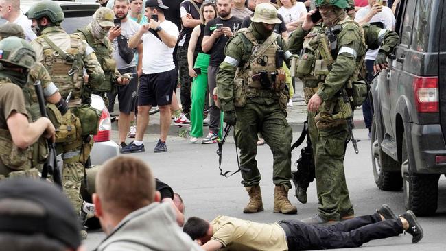 Members of the Wagner Group detain a man in the city of Rostov-on-Don on Saturday. Picture: AFP