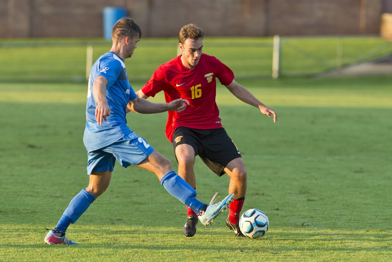 Matthew Hull of South West Queensland Thunder tackles Kaelan Debbage of Sunshine Coast Fire in NPL Queensland men round nine football at Clive Berghofer Stadium, Saturday, March 30, 2019. Picture: Kevin Farmer