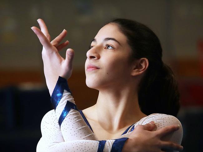 Leila Ghazi, 12, posing at her gymnasium, at Westfields Sports School in Fairfield West, NSW, Australia. 14 July, 2018. Leila is an aerobic gymnast who is our Local Sports Star nominee this week. (AAP IMAGE / Carmela Roche).