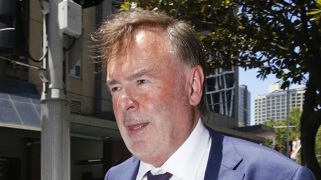 Former Tasmanian Supreme Court Judge Gregory Geason leaves Downing Centre Court in Sydney after receiving a 12 month community corrections order for breaching an AVO. Picture: NewsWire / John Appleyard