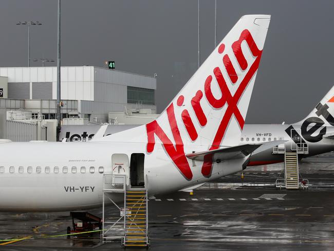 SYDNEY, AUSTRALIA - NewsWire Photos JUNE 28, 2021: Virgin and Jetstar Planes seen at Domestic Airport Terminal during the current Covid-19 Lockdown, Sydney Australia. Picture: NCA NewsWire / Gaye Gerard