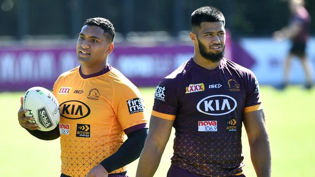 Tevita Pangai Junior (left) and Payne Haas (right) are seen during Brisbane Broncos training at Clive Berghofer Field in Brisbane, Tuesday, June 2, 2020. The Broncos will play the Roosters in their round 4 match at Suncorp Stadium on Thursday night. (AAP Image/Darren England) NO ARCHIVING