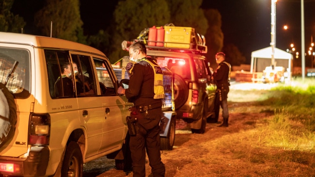 These two vehicles, photographed at the Hume Freeway checkpoint, were both turned around. Picture: Simon Dallinger