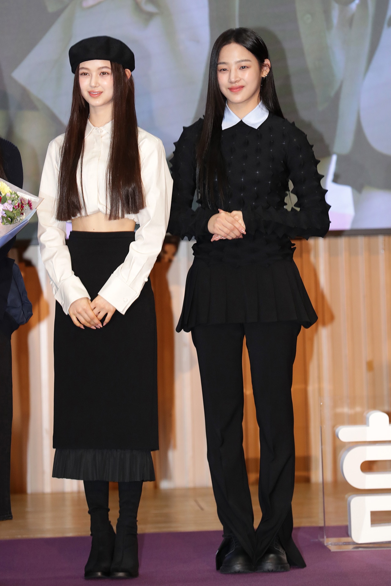 <p><em>Image credit: Getty Images</em></p><p>Danielle wears Max Mara and Unif and Minji wears Enfold and YCH at the Seoul PR ambassador appointment ceremony on 16 February 2023.&nbsp;</p>