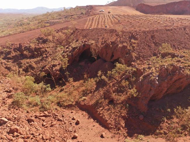 (FILES) This handout file photo taken on May 15, 2020 and released by the PKKP Aboriginal Corporation and received by AFP on May 27, 2020 shows Juukan Gorge in Western Australia -- one of the earliest known sites occupied by Aboriginals in Australia. - Rio Tinto announced the resignation of its CEO and two top lieutenants on September 11, 2020 over the mining giant's destruction of a 46,000-year-old Aboriginal site to expand an iron ore mine in Australia. The Anglo-Australian firm faced a growing investor revolt over the destruction of the sacred site in the Juukan Gorge in Western Australia's remote Pilbara region -- one of the earliest known locations inhabited by Australia's indigenous people. (Photo by Handout / PKKP Aboriginal Corporation / AFP) / RESTRICTED TO EDITORIAL USE - MANDATORY CREDIT "AFP PHOTO / PKKP ABORIGINAL CORPORATION" - NO MARKETING NO ADVERTISING CAMPAIGNS - DISTRIBUTED AS A SERVICE TO CLIENTS - NO ARCHIVES