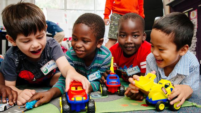 Toy trucks werer a hit with (from left) Samuel Auzner, Samuel Angallo, Andrew Tem and Jerry Adamson at the orientation day in Lalor Park. Picture: Jonathan Ng