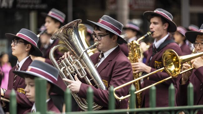 Members of the St Peters Lutheran College marching band make their way through the Brisbane city streets for the ANZAC Day parade. Picture: NCA NewsWire / Matthew Poon